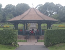 brass band performing in the park bandstand