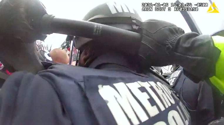 police body camera video footage from the capitol riot, appearing to show the bodycam wearer intentionally pushing the riot helmet off the person in police uniform in front of them. https://twitter.com/NPR/status/1408065129782992902